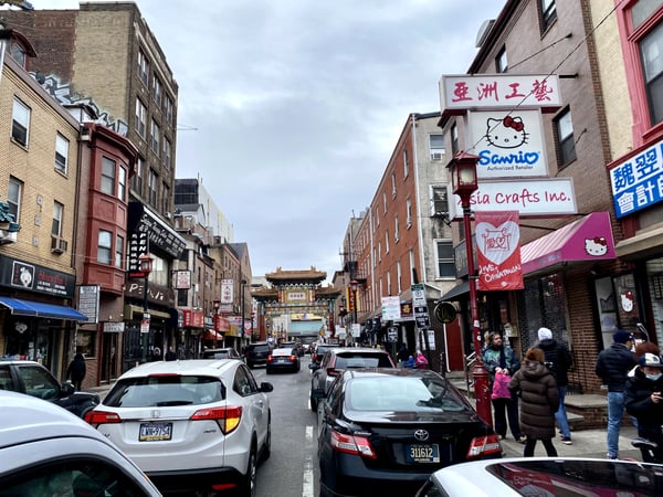 Philadelphia's Chinatown street with ornamental gateway, brick buildings, and shops displaying Asian signage and… — Center City, Philadelphia