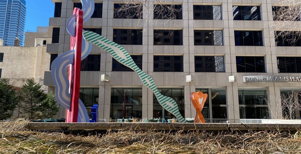 Colorful public art sculptures displayed on a plaza in front of a modern building in Philadelphia. — Center City, Philadelphia