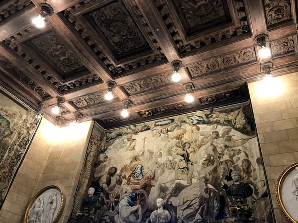 Ornate wooden coffered ceiling with decorative reliefs and Renaissance-style religious frescoes displayed on interior… — Hearst Castle, Big Sur & the Highway 1 Coast