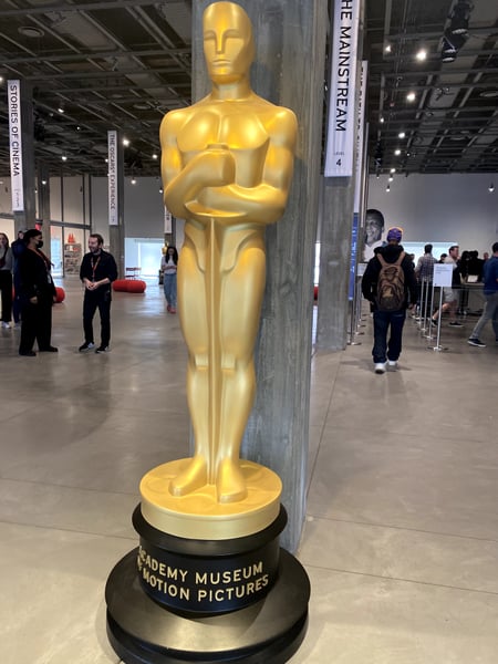 Giant golden Oscar statue at Academy Museum of Motion Pictures in Los Angeles, photographed from ground level in the…