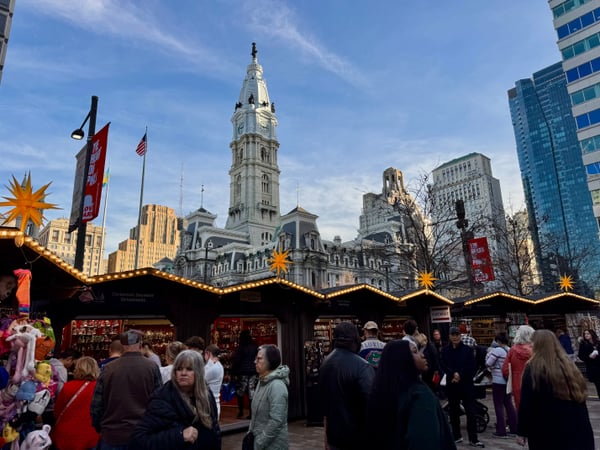 Christmas market stalls with illuminated decorations in front of City Hall with its distinctive clock tower in… — Center City, Philadelphia