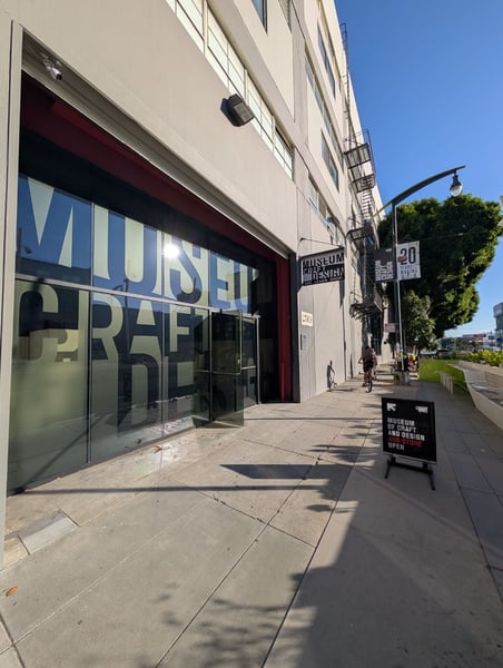 Museum of Craft and Design storefront on a pedestrian street in San Francisco's Mission Bay district.