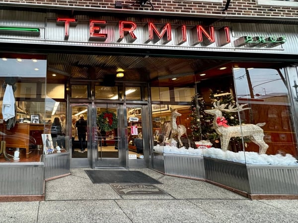 Storefront of Termini Bros. Cafe with holiday decorations and window display on South 8th Street in Philadelphia. — South Philadelphia, Philadelphia