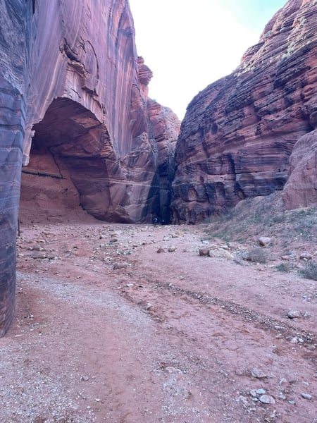 Narrow desert canyon with towering red rock walls and sandy floor, viewed from within the gorge. — The Wave Trail, Kanab & The Wave