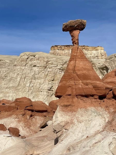 Hoodoo rock formation with distinctive balanced stone cap in arid desert landscape near Kanab, Utah. — Kanab & The Wave