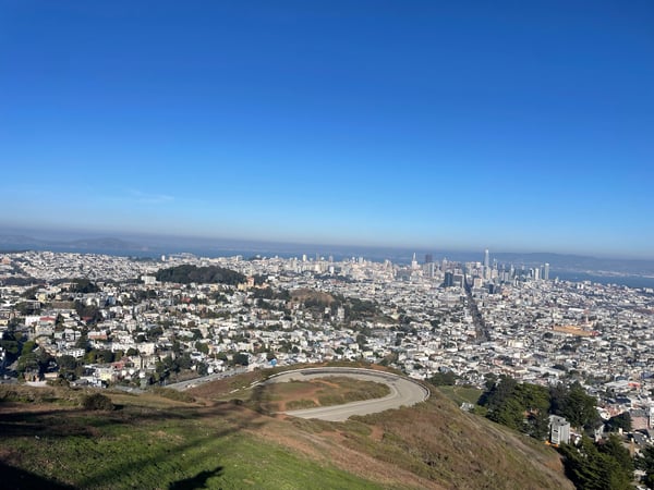 San Francisco cityscape and bay viewed from Twin Peaks, with a circular sports facility visible in the foreground. — Midtown Terrace, San Francisco