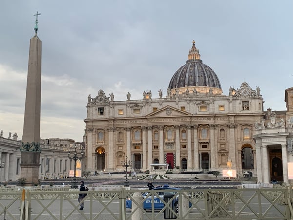 St. Peter's Basilica with its iconic dome and obelisk viewed from St. Peter's Square in Vatican City. — Borgo, Rome