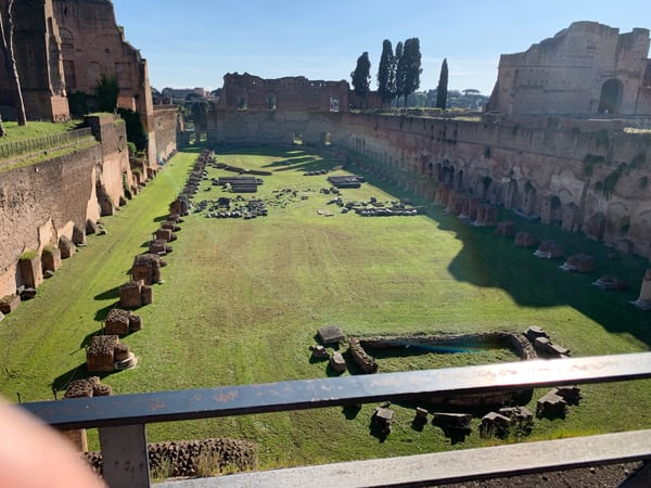 Ruins of the Stadium of Domitian on the Palatine Hill in Rome, viewed from an elevated vantage point with ancient brick… — Campitelli, Rome