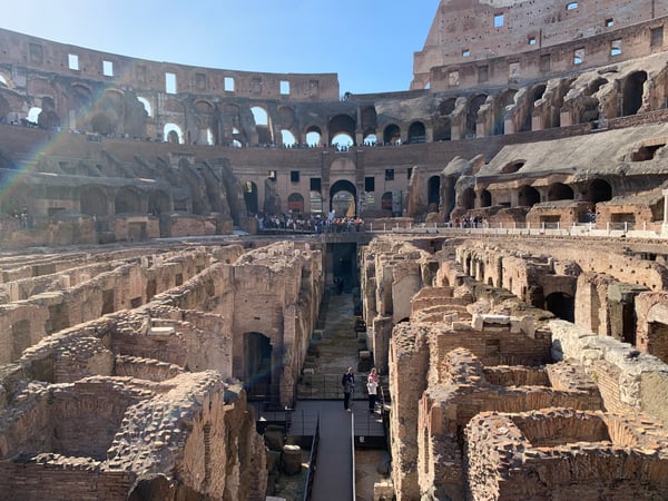 Interior of the Colosseum in Rome showing the arena floor and hypogeum structures from the ground level vantage point. — Campitelli, Rome